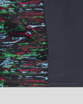 Close up of navy Harlequins training top showing a multicolor abstract print panel on the left side against solid navy fabric.