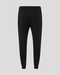 Back view of black women's Harlequins travel pants with elastic waistband