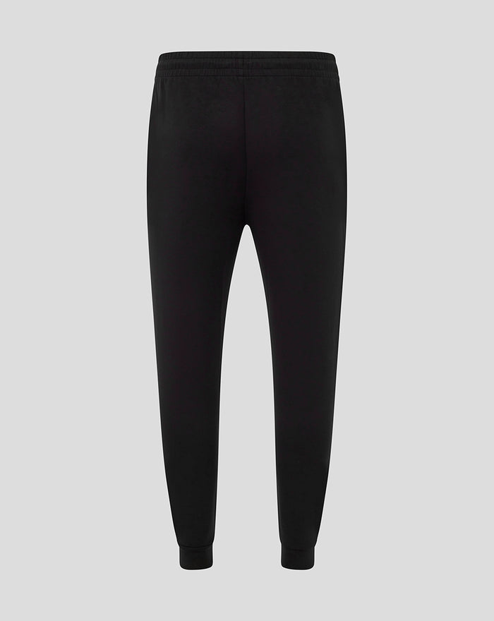 Back view of black women's Harlequins travel pants with elastic waistband