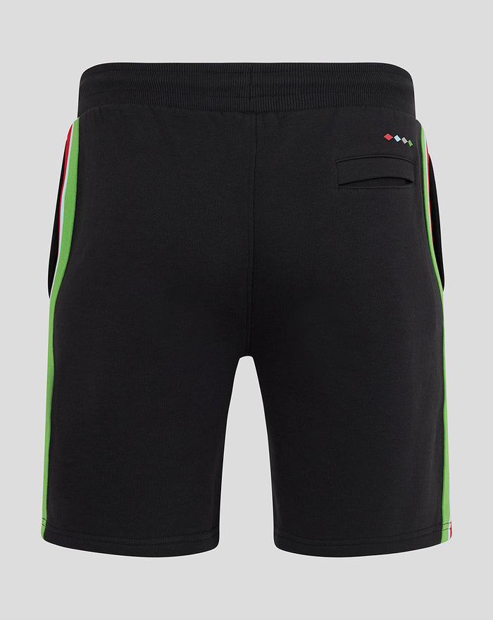 Back view of black shorts with neon green side panels and a small rear pocket.