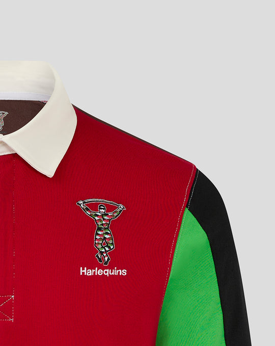 Close-up of the Harlequins rugby shirt showing a red chest panel with crest and a white collar
