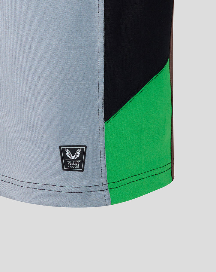 Close-up of Harlequins home shirt fabric featuring a light blue panel, black and bright green diagonal panels, with a Castore authentic badge.