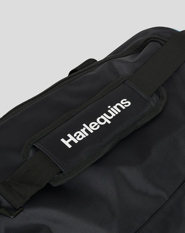 Close up of carry handle area with Harlequins label on the strap and top zipper