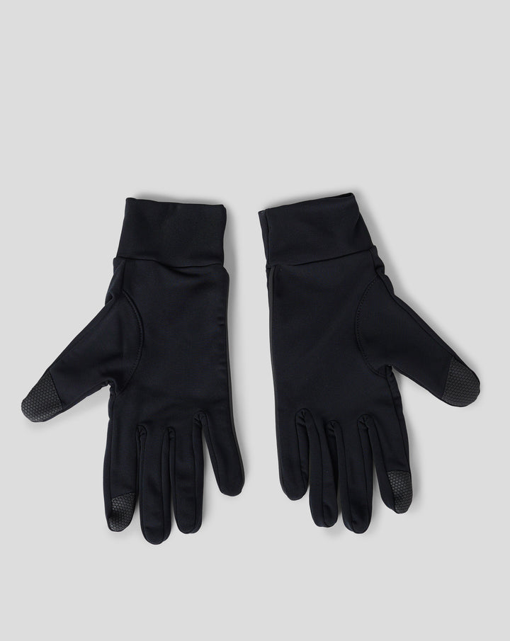 Close-up of black unisex gloves showing the white wing logo on the cuff area.