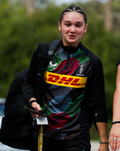 Harlequins matchday midlayer top worn by a player outdoors with DHL logo across the chest
